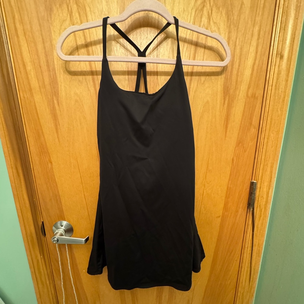 HALARA Black cross strapy workout dress with built in shorts with pockets